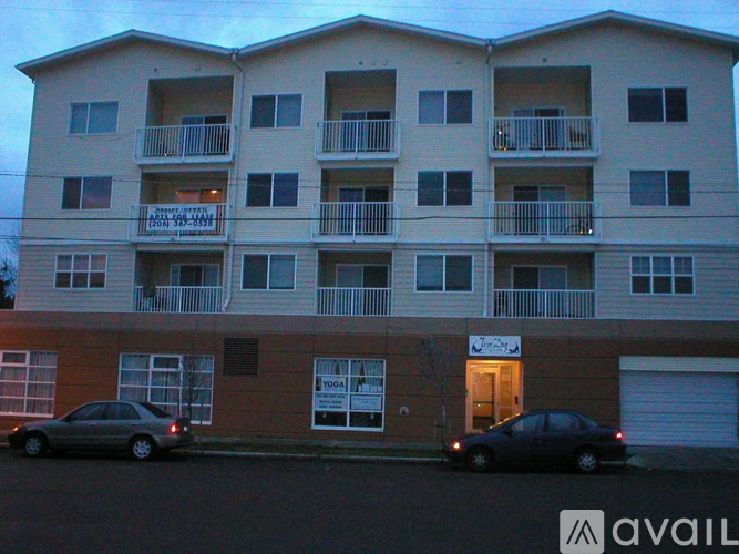 A building with a car parked in front of it.