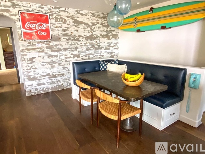 A dining area with a Coca-Cola sign on the wall.