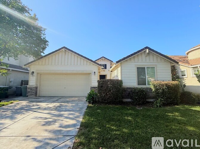 A house with a garage is for sale.