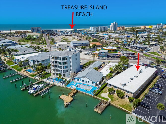 A bird's eye view of Treasure Island Beach with a red arrow pointing to a building.