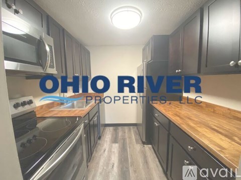 A kitchen with the words Ohio River Properties LLC on the wall.