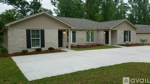 A house with a driveway in front of it.