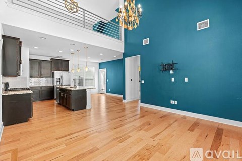 A spacious kitchen with dark wood cabinets and a white island.
