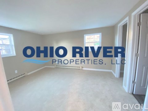 A room with a sign that says "OHIO RIVER PROPERTIES, LLC" on the wall.