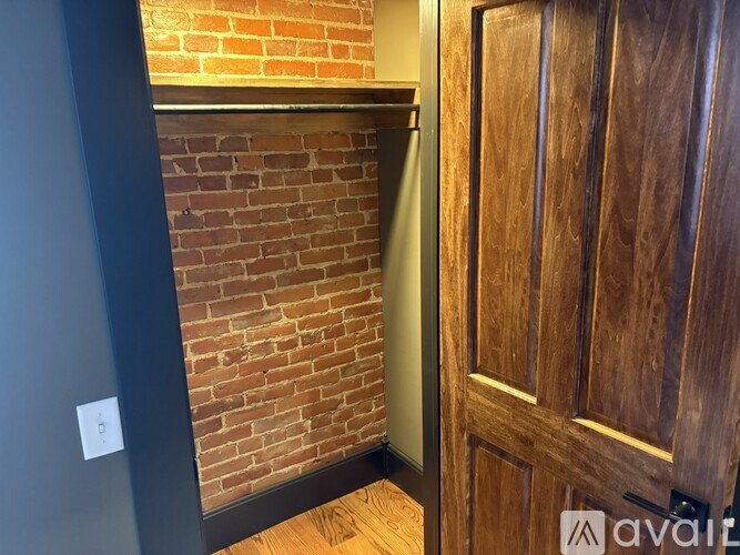 A wooden door is on the right side of the image.