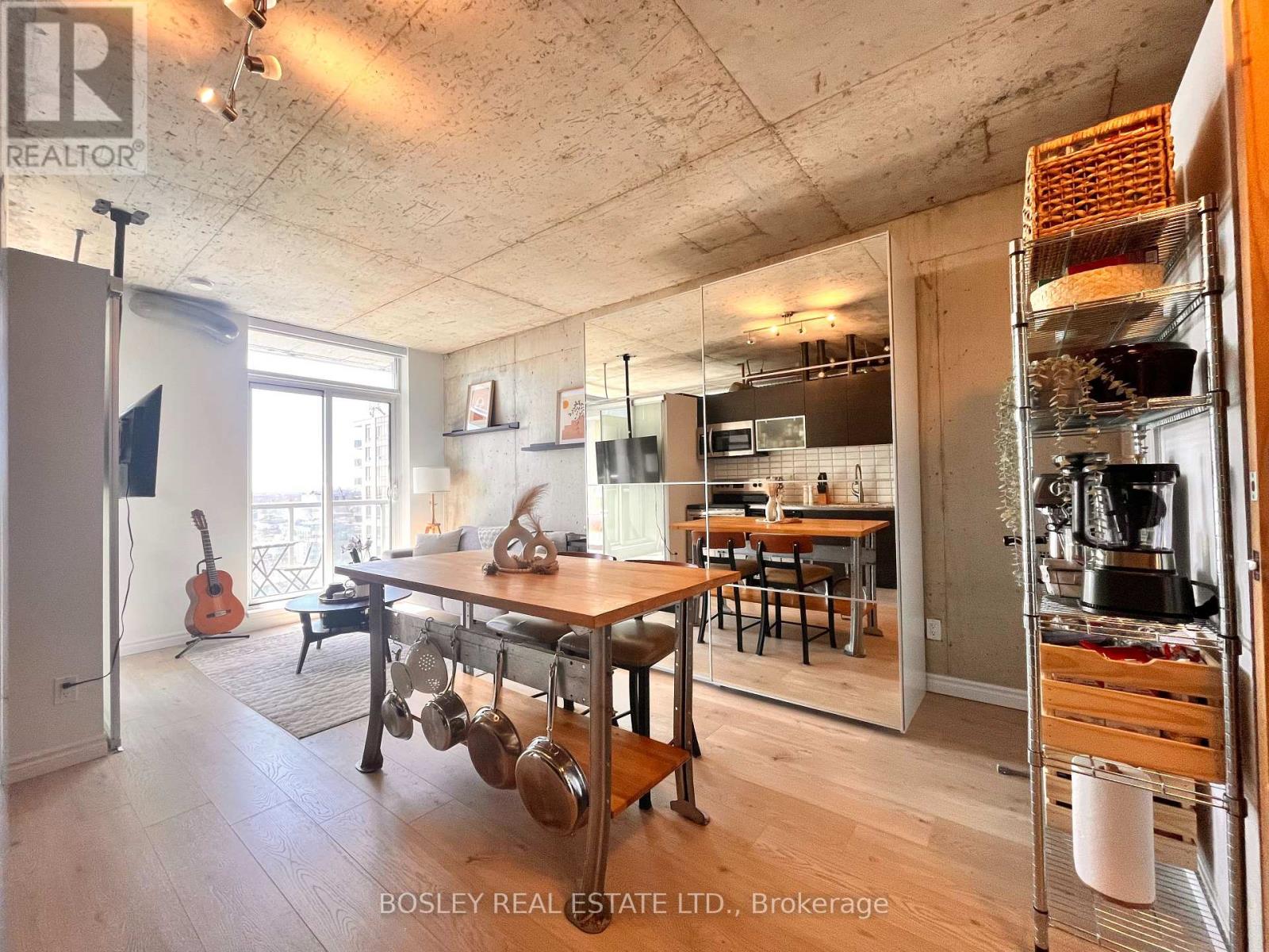 A kitchen with a table and chairs in the middle of the room.