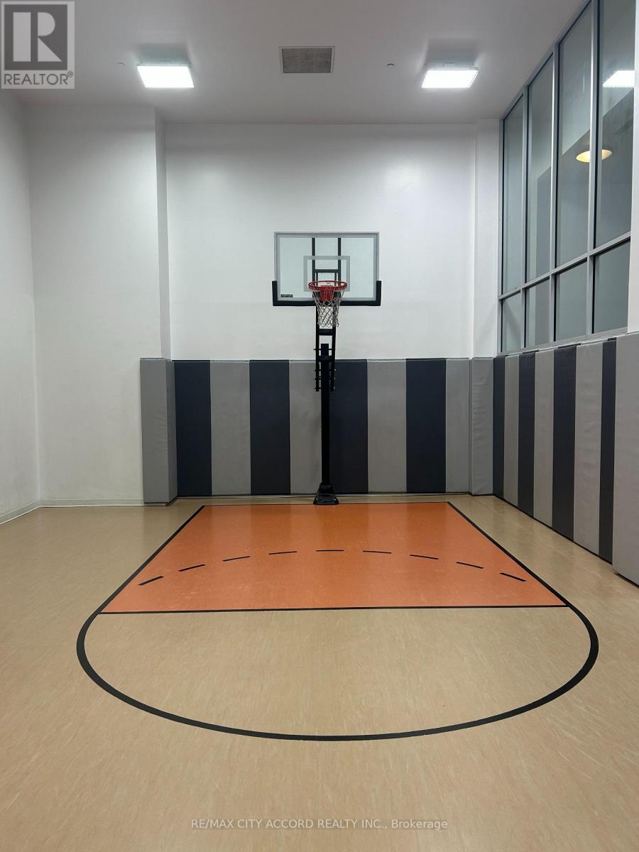 A basketball court with a hoop and a backboard.