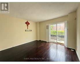 A room with Everland Realty Inc. sign on the wall.