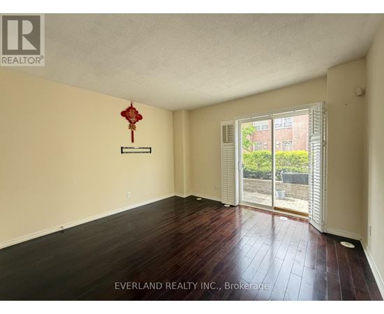 A room with Everland Realty Inc. sign on the wall.