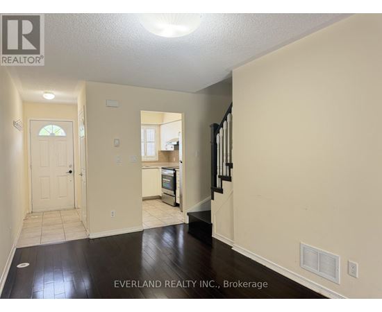 A room with Everland Realty Inc. logo on the wall.