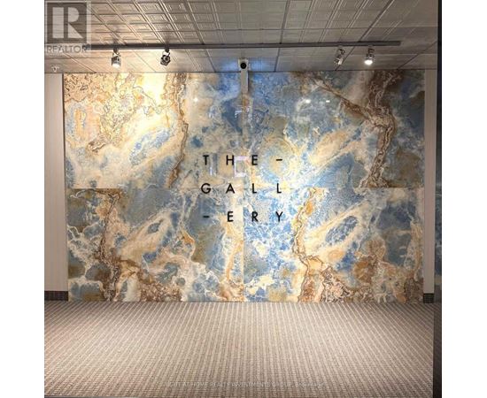 A wall with a map design and the words "The Gallery" written on it.