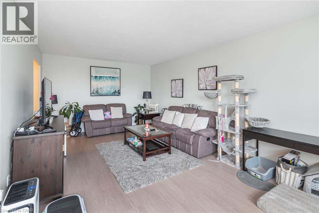 A living room with a grey couch and a wooden coffee table.