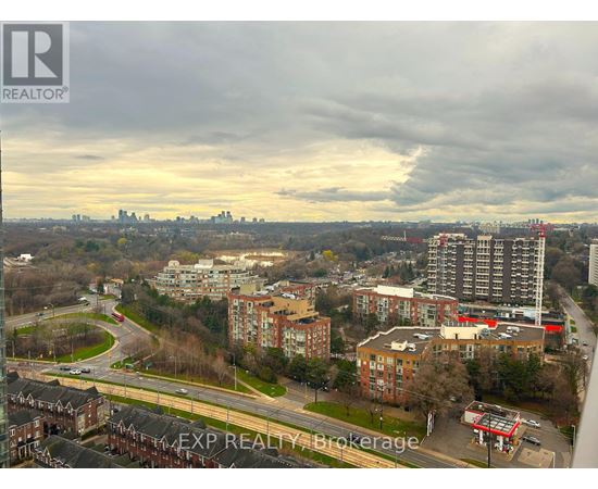 A cityscape with buildings and a road.