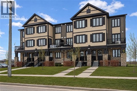 A large two story house with a balcony on the second floor.