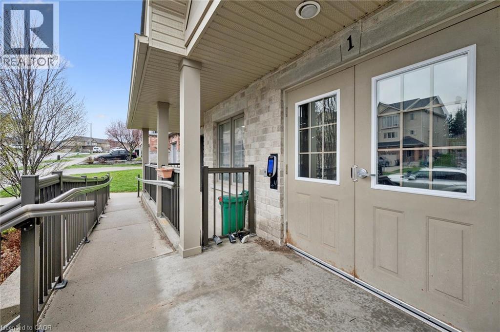 A view of a house entrance with a door and a window.