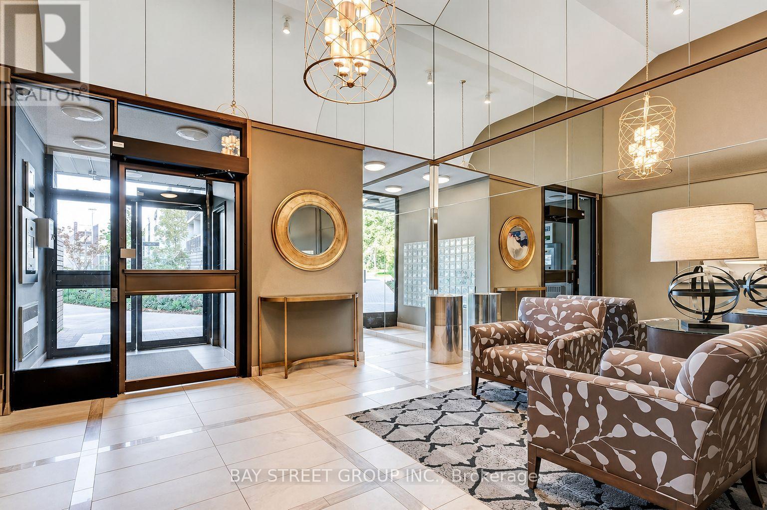 A well-lit, modern living room with a glass door leading to a balcony.