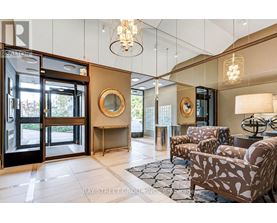 A well-lit, modern living room with a glass door leading to a balcony.