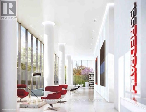 A modern living room with red chairs and a white floor.