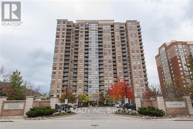 A tall apartment building with a sign in front that says "Pinehurst Apartments".
