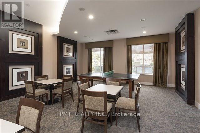 A dining room with a table set for six.