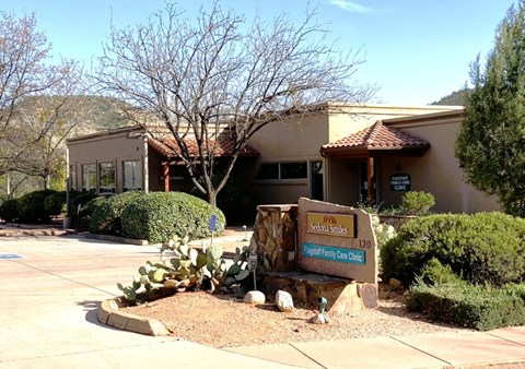 The image shows a building with a sign in front that reads "Selco Family Care Clinic.".