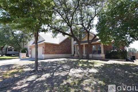 A house with a tree in front of it.