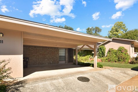 A house with a driveway and a garage door.