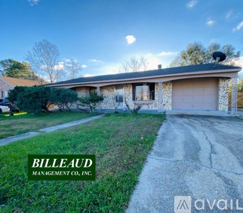 A house with a driveway in front of it is for sale.