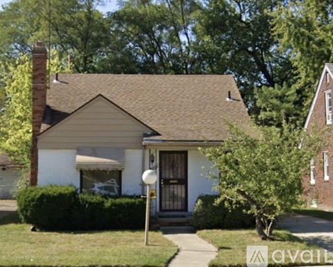 A house with a brown roof and a white door is for sale.
