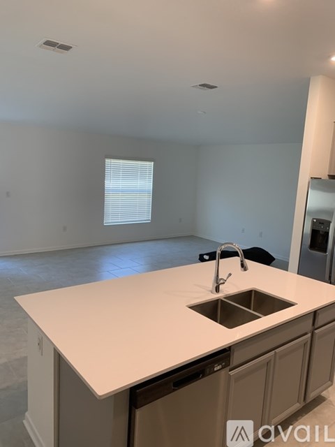 A kitchen with a sink and a countertop.