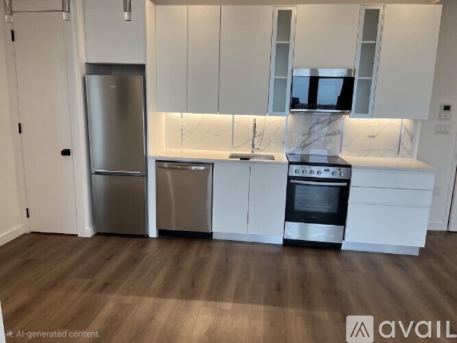 A kitchen with white cabinets and a marble backsplash.