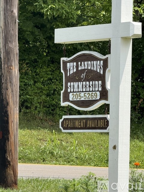 A sign for The Landings of Summerside with a phone number and an apartment available.