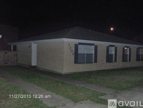 A building with the number 25 on it is shown in a nighttime setting.