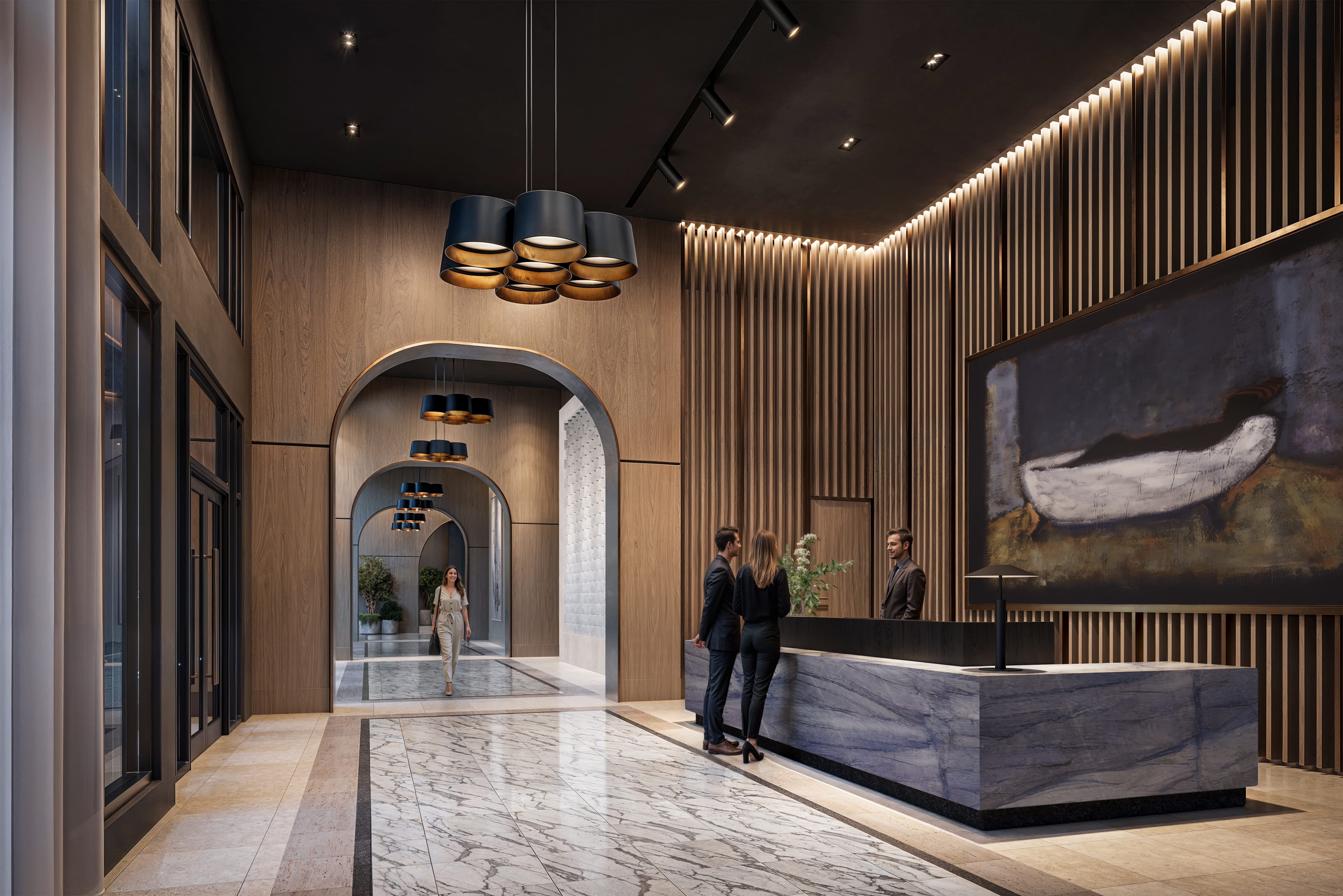 A reception area with people standing by the counter.