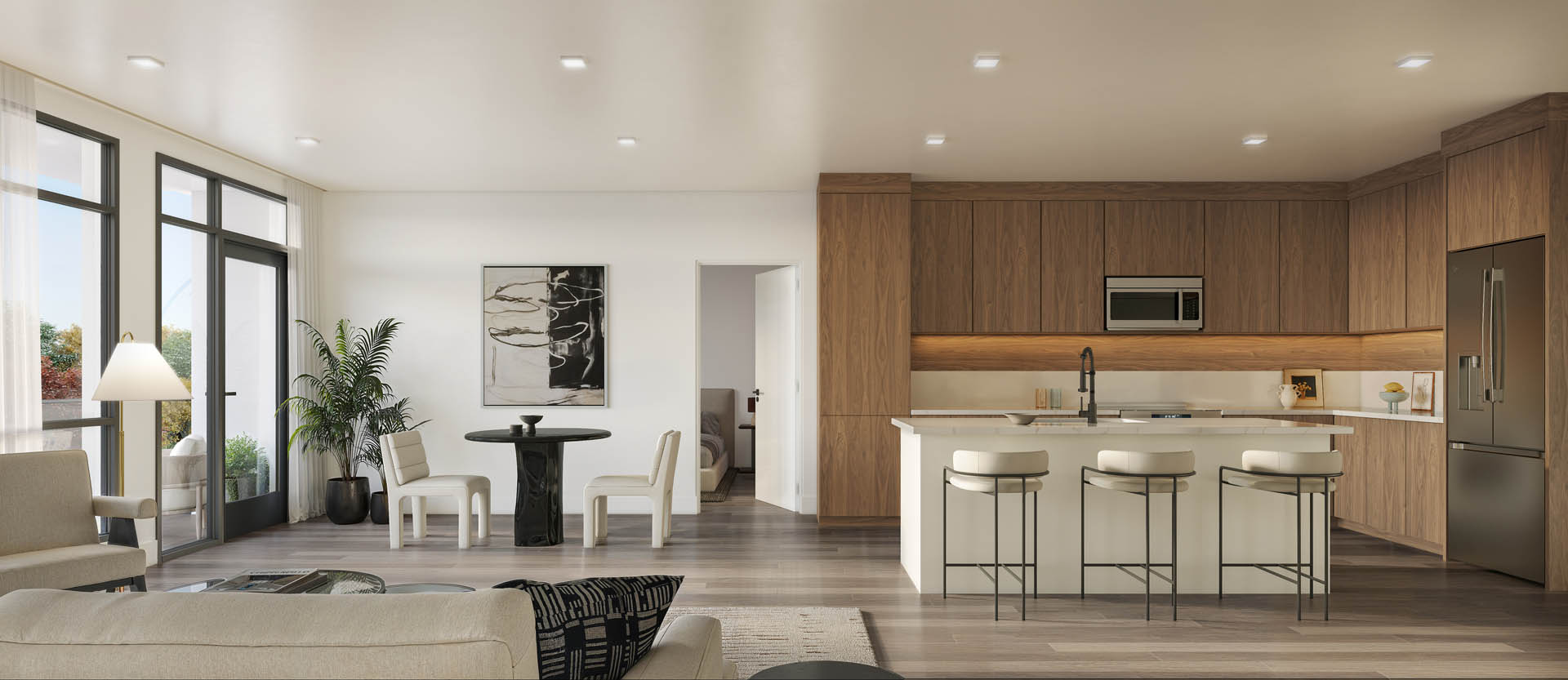 A modern kitchen with a bar stool and a dining table.