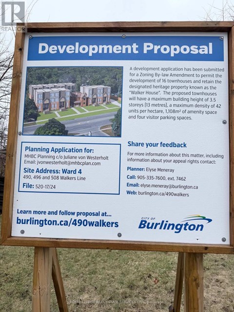 A sign for a development proposal for 16 townhouses.