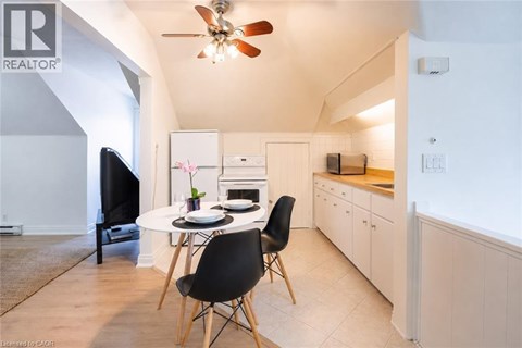 A modern kitchen with a dining table and chairs.