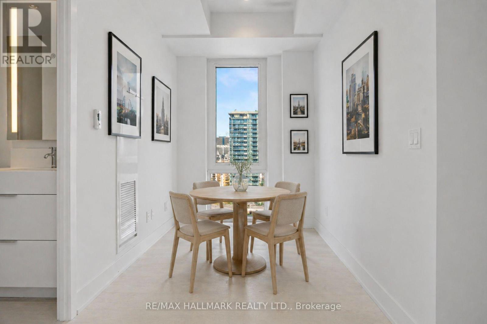A dining room with a table set for four.