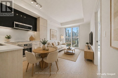 A modern kitchen with a dining table set for four.