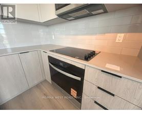 A kitchen with a stove top oven and a microwave above it.
