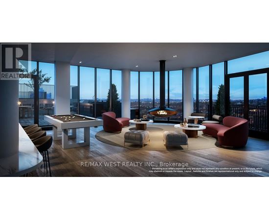 A living room with a pool table and a fireplace.