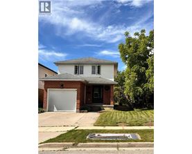 A house with a garage is for sale.