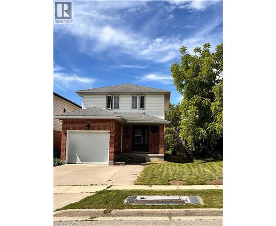 A house with a garage is for sale.