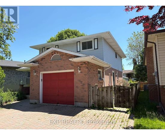 A house with a red garage door is for sale.