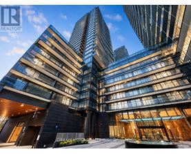 A modern building with glass windows and a sign that reads "Dream On Realty.".