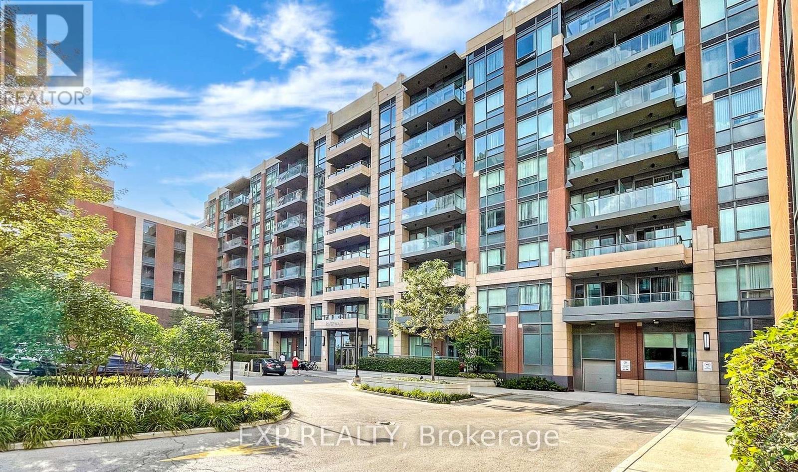 A modern apartment building with a clear blue sky above.