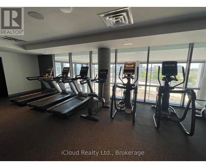 A gym with treadmills and exercise bikes.