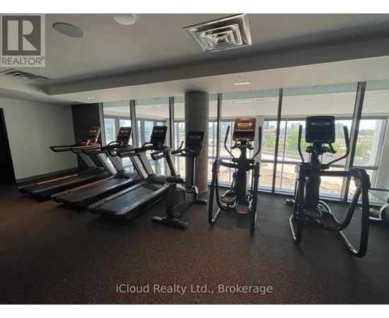 A gym with treadmills and exercise bikes.