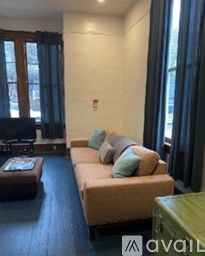 A living room with a couch and a coffee table.