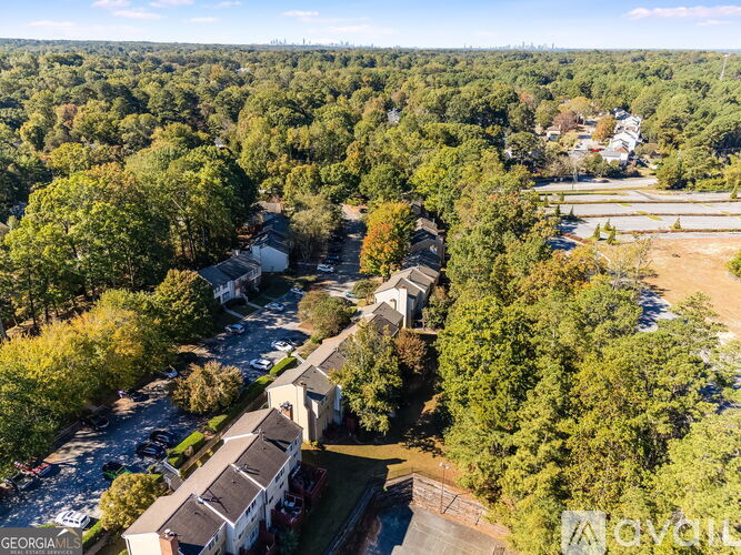 A bird's eye view of a residential area with houses and trees.